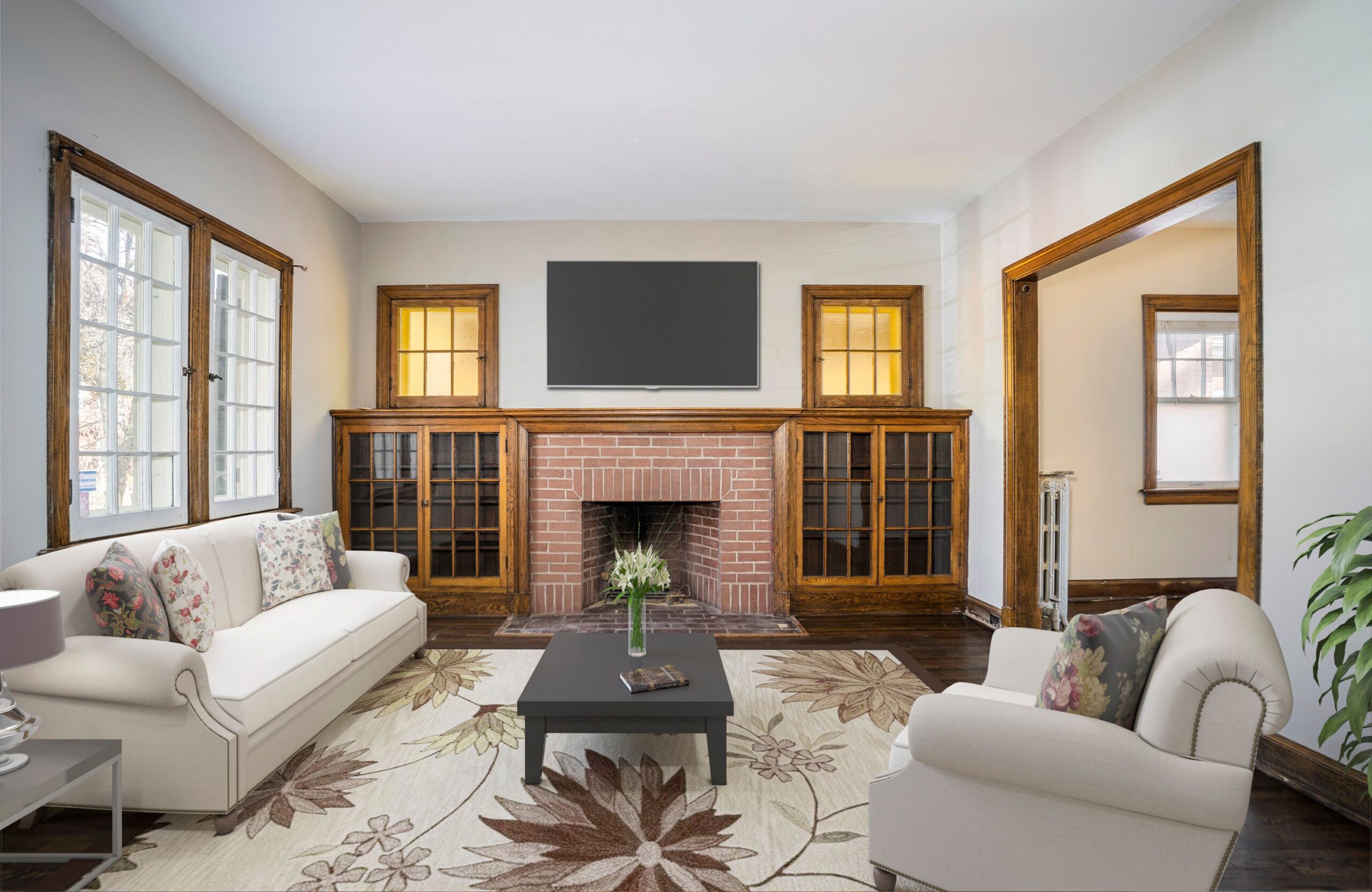 Stylish living room features cozy furniture and a brick fireplace.